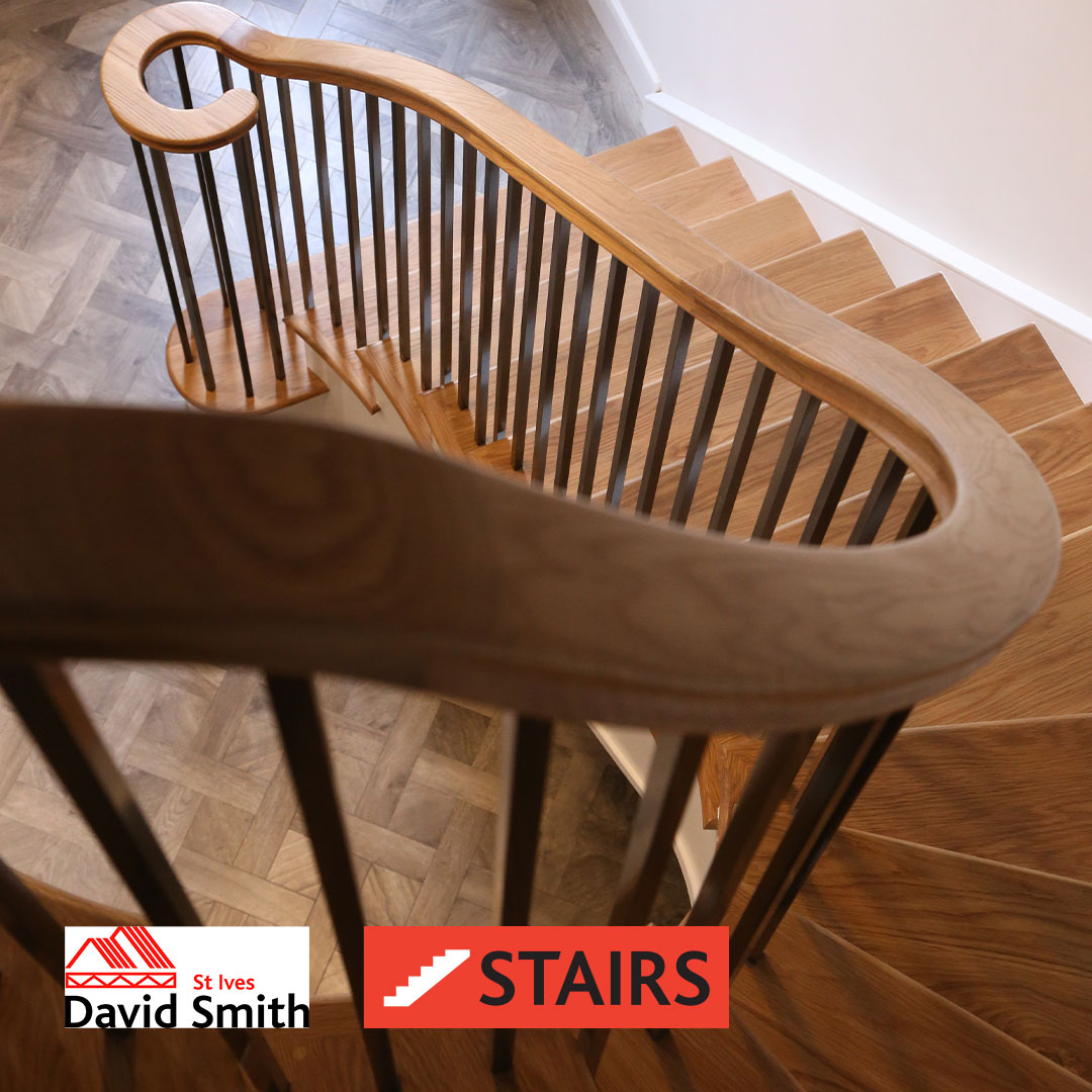 Arial view of staircase with focus on wooden hand rail