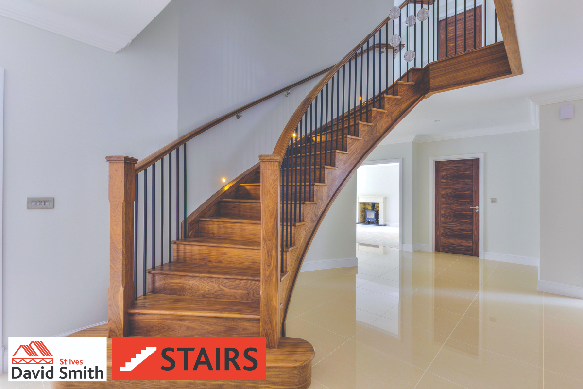 Dark wooden staircase in open hallway of house