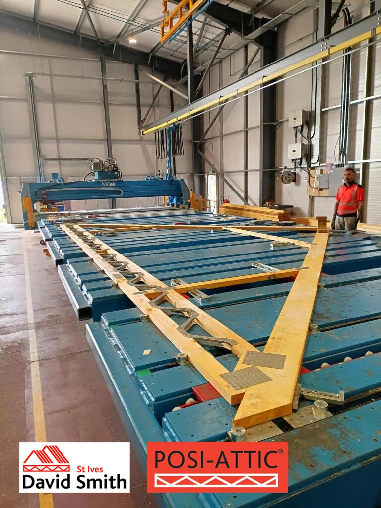 Posi attic truss on work table in factory