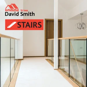 Glass wall surrounding staircase on landing