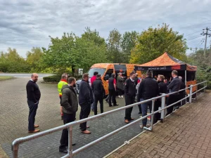 People queuing outside food tent