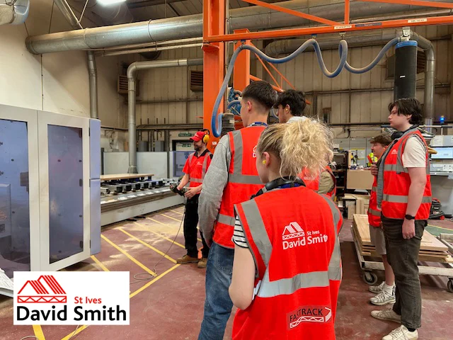 White lorry covered in DSSI imagery and branding on a road on a sunny day.