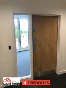 Door with a screen fitted in a room