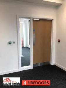 Door and screen fitted in a room