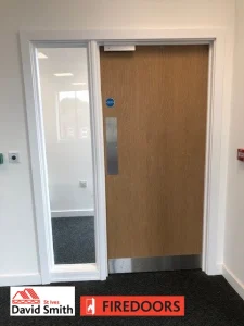 Door with a screen fitted in a room