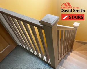 Oak stairs with yellow wall