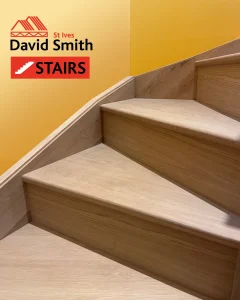 Oak stairs with yellow wall
