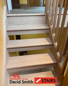 Oak stairs with yellow wall