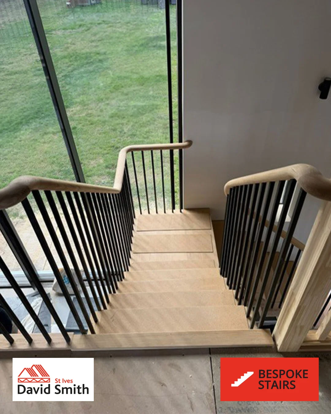 DSSI News 3 oak stairs leading to a window with grass outside